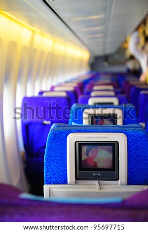SINGAPORE - FEBRUARY 12: Inflight entertainment system in economy class cabin in Singapore Airlines\' (SIA) last Boeing 747-400 aircraft at Singapore Airshow February 12, 2012 in Singapore