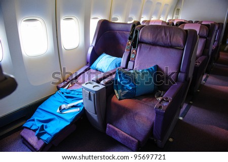 SINGAPORE - FEBRUARY 12: Business class seats in Singapore Airlines\' (SIA) last Boeing 747-400 aircraft at Singapore Airshow February 12, 2012 in Singapore