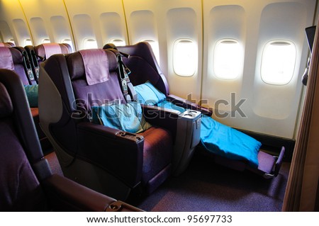 SINGAPORE - FEBRUARY 12: Business class seats in Singapore Airlines\' (SIA) last Boeing 747-400 aircraft at Singapore Airshow February 12, 2012 in Singapore