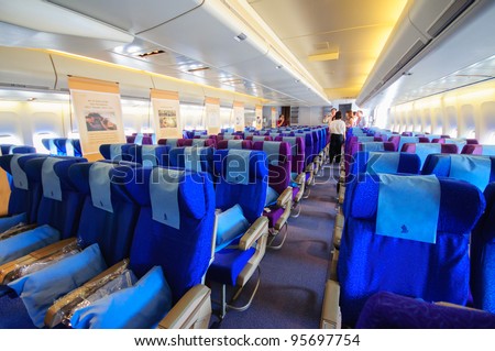 SINGAPORE - FEBRUARY 12: Economy class cabin in Singapore Airlines\' (SIA) last Boeing 747-400 aircraft at Singapore Airshow February 12, 2012 in Singapore