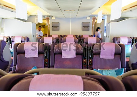 SINGAPORE - FEBRUARY 12: Spacious business class seats in Singapore Airlines\' (SIA) last Boeing 747-400 aircraft at Singapore Airshow February 12, 2012 in Singapore