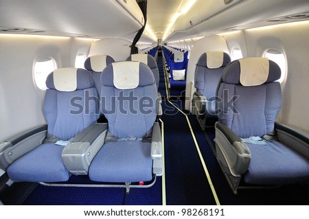 SINGAPORE - FEBRUARY 17: Spacious business class cabin in China Southern Airlines Embraer 190 aircraft at Singapore Airshow February 17, 2012 in Singapore