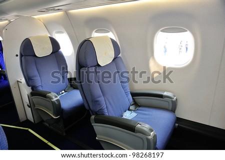 SINGAPORE - FEBRUARY 17: Spacious business class seats in China Southern Airlines Embraer 190 aircraft at Singapore Airshow February 17, 2012 in Singapore