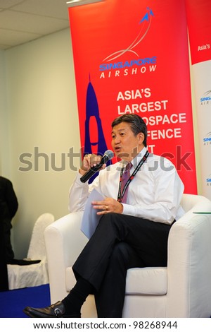SINGAPORE - FEBRUARY 17: Mr Jimmy Lau, Managing Director of Experia Events, speaking at the wrap-up media briefing at Singapore Airshow February 17, 2012 in Singapore