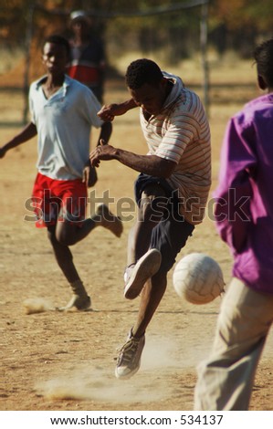 football player practising his skills on a makeshift football pitch, Namibie, Southern Africa