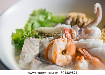 Thai-style seafood boiled rice, soft background