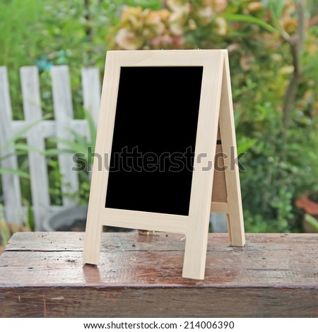 empty Wooden black board (menu board) at a coffee Shop