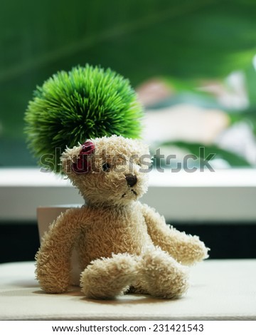 Loneliness teddy bear red bow on head