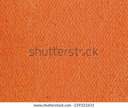 Texture of a  orange color canvas with a dense grid.Abstract handmade