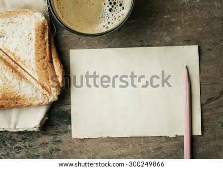 empty paper note  with coffee and bread wheat.