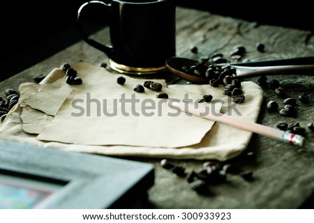 vintage paper with space and Coffee cup on wooden table. Vintage Style.
