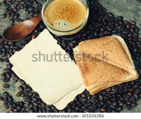 empty paper note with coffee and bread.