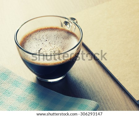 cup of coffee on table.Coffee cup with black coffee. Vintage Style.