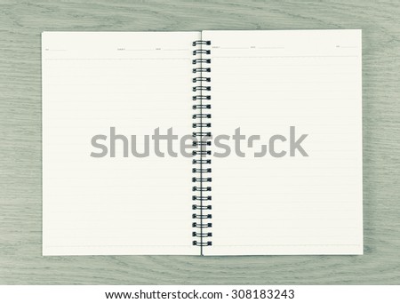 Blank Notepad on wood background.Blank paper . Vintage Style.