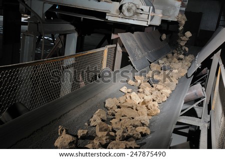 stone transportation by conveyor for processing to produce insulation stone wool
