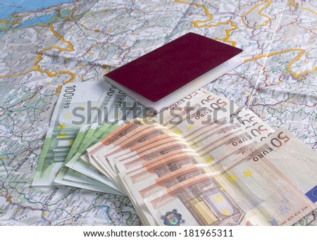 passport, money and a map on the table, close up