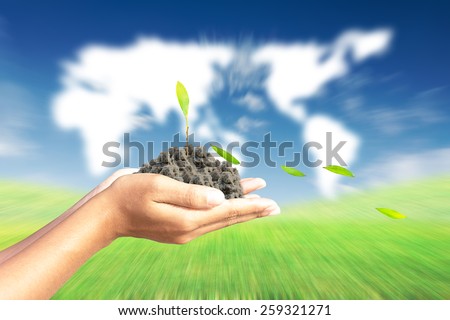 We love the world of ideas, man planted a banana in the hands world map background