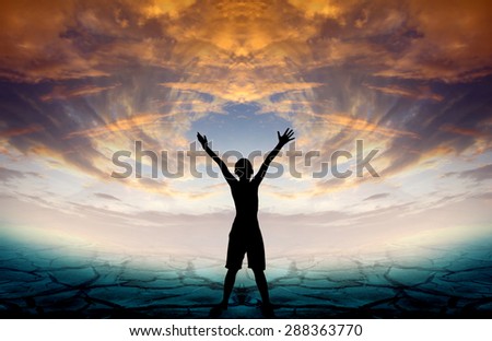 Human hand side above the background sky orange.
