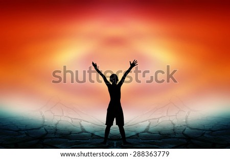 Human hand side above the background sky orange.