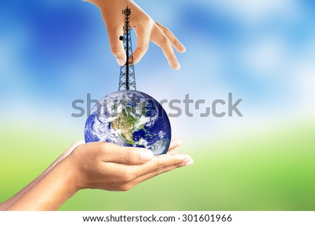 Phone antenna and earth in human hands.Elements of this image furnished by NASA.