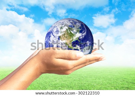 We love the world of ideas.world in human hands. Natural background blur. Elements of this image furnished by NASA.
