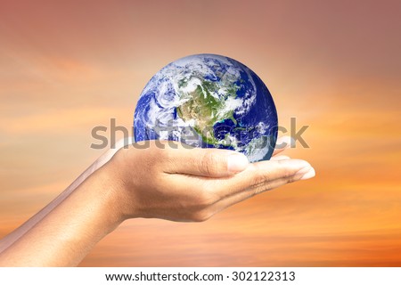 We love the world of ideas.world in human hands.Sky background. Elements of this image furnished by NASA.