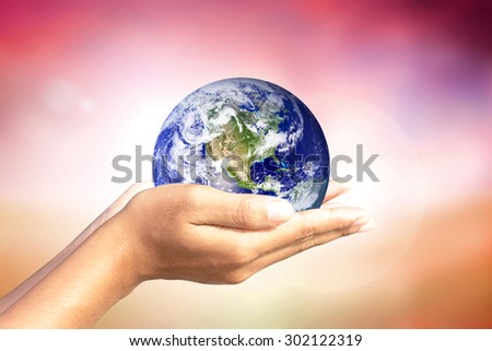 We love the world of ideas.world in human hands. Natural background blur. Elements of this image furnished by NASA.