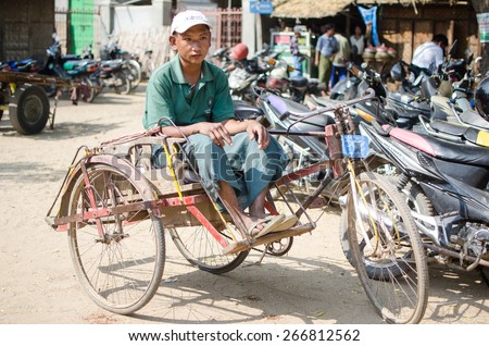 BAGAN , BURMA - 20 FEB 2015 : The guy in the market with his occupation