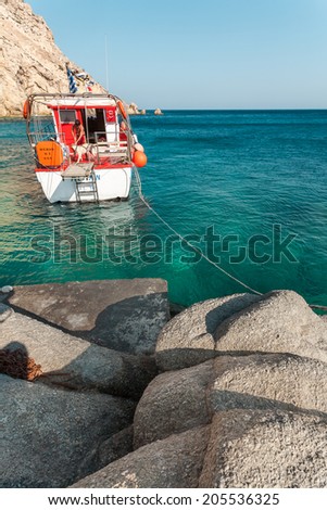 IKARIA ISLAND, GREECE - AUGUST 23, 2007: People work in a cruise boat, preparing the vessel for the next trip destination, as part of their daily job, during summer, in order to make a living.