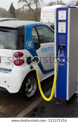 STUTTGART, GERMANY - NOV 30: A Car2go electric car at one of the 500 charging points on November 30, 2012 in Stuttgart, Germany. Car2go has over 300 electric Smart cars in the city of Stuttgart.