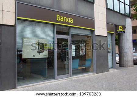 SEVILLE, SPAIN - MAY 15: A Bankia bank branch on May 15, 2013 in Seville, Spain.  Bankia must close branches under the terms of the largest bank bailout, 24.5 billion euros, in SpainÃ¢Â?Â?s history.
