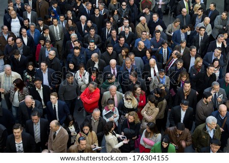 VALENCIA, SPAIN - FEBRUARY 12, 2014: A crowd of business people waiting to enter the 2014 Feria Habitat Valencia Trade Fair in Valencia.