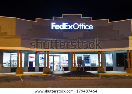 JACKSONVILLE, FL - FEBRUARY 25, 2014: A FedEx Office retail store at night. FedEx Office is a chain of stores that provide a retail outlet for FedEx Express and FedEx Ground shipping.