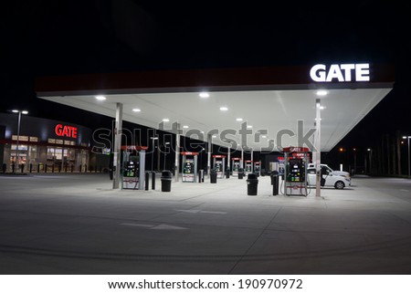 JACKSONVILLE, FL - MAY 5, 2014: A Gate Petroleum gas station at night in Jacksonville. Gate Petroleum is headquartered in Jacksonville and has over 225 gas stations with over 2,200 employees.