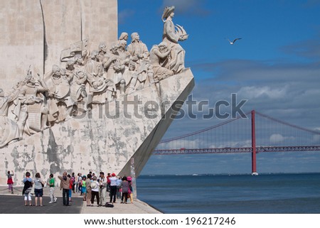 LISBON, PORTUGAL - MAY 28, 2014: Tourist visiting the Monument to the Discoveries in Lisbon. The monument celebrates the Portuguese Age of Discovery during the 15th and 16th centuries.