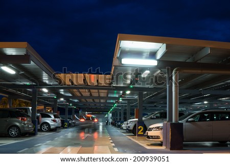 VALENCIA, SPAIN - JUNE 25, 2014: Inside the parking garage at the Valencia airport.  Situated 8 km from the city it is the 8th busiest Spanish airport with flight connections to 15 European countries.