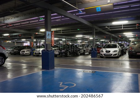 VALENCIA, SPAIN - JUNE 26, 2014: Inside the parking garage at the Valencia airport.  Situated 8 km from the city it is the 8th busiest Spanish airport with flight connections to 15 European countries.