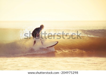 Surfing in the early morning with filter effect applied.