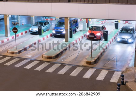 Cars exiting a parking garage at the airport.