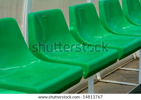 stock-photo-green-plastic-seats-outdoors-at-a-stadium-14813767.jpg