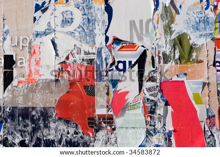 stock photo A Torn Advertisement Background from Old Posters