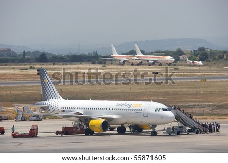 VALENCIA, SPAIN - JUNE 24: Vueling Airlines will start connections on July 5 in Barcelona, which will increase their passengers by 250,000. A Vueling aircraft at the Valencia Airport on June 24, 2010.