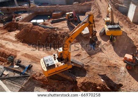 Construction site with yellow tractors Construction site with yellow tractors
