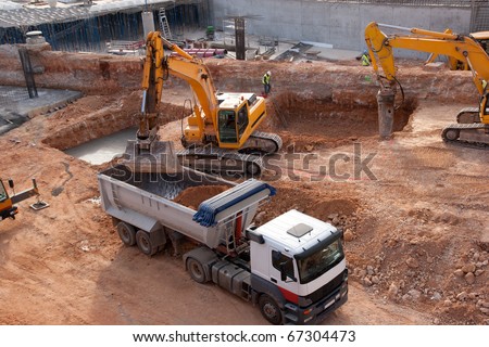 Construction site with tractors and dump truck