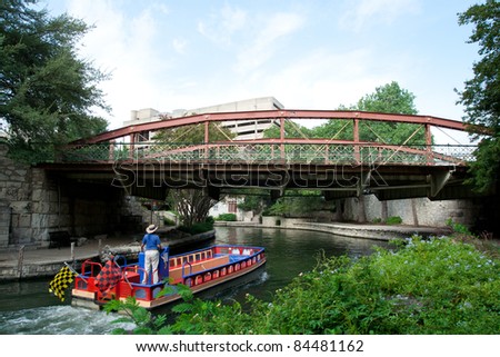 SAN ANTONIO, TX - AUG 12: A River Taxi at the River Walk in San Antonio, Texas on August 12, 2011.  The River Walk is 5 miles along the San Antonio River with over 20 yearly events.
