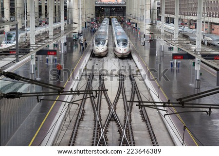 MADRID, SPAIN - OCTOBER 9, 2014: High speed trains in Atocha Station in Madrid. Spain\'s main cities are connected by high-speed trains.