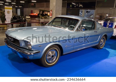 VALENCIA, SPAIN - OCTOBER 17, 2014: A blue classic Ford Mustang at the Retro Auto and Moto Valencia Classic Car Show. The Ford Mustang was introduced on April 17, 1964 at the New York World\'s Fair.