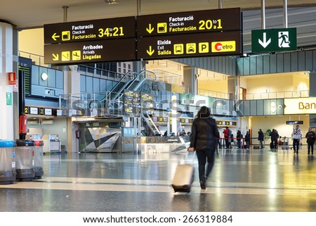 VALENCIA, SPAIN - FEBRUARY 14, 2015: Airline passengers inside the Valencia Airport. About 4.59 million passengers passed through the airport in 2013.