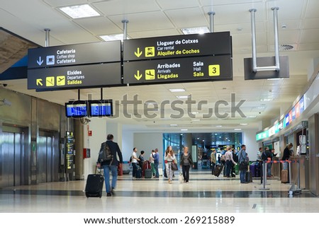 VALENCIA, SPAIN - APRIL 13, 2015: Airline passengers inside the Valencia Airport. About 4.59 million passengers passed through the airport in 2013.