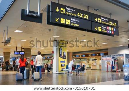 VALENCIA, SPAIN - SEPTEMBER 12, 2015: Airline passengers inside the Valencia Airport. About 4.59 million passengers passed through the airport in 2014.